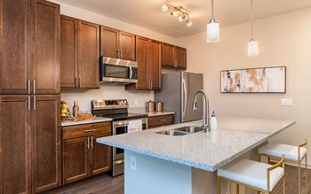 Kitchen with island and breakfast bar seating
